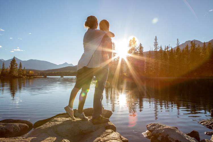 couple hugging at shore of lake tahoe